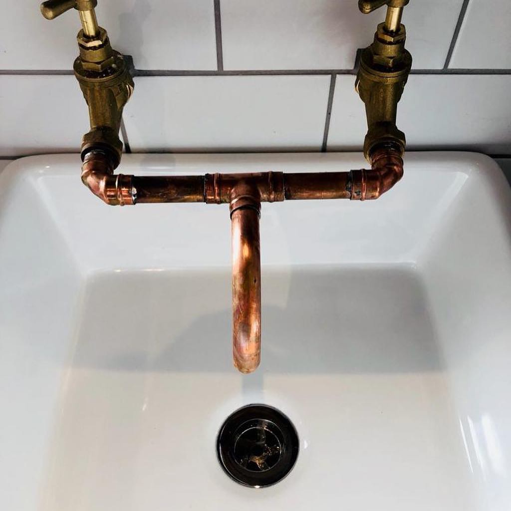 Bespoke bathroom in Patcham with copper taps and designer shower